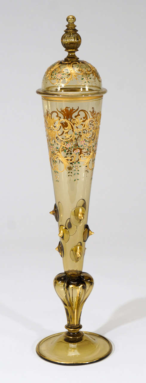This is an exquisite example of a 19th C. Moser hand blown Pokal with the finest detailed decoration. It is tall and elegant, standing 18 inches and is embellished with applied prunts, a complex lobed connector at the base and gilt trim throughout.