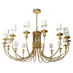 Monumental Sixteen Arm Brass Chandelier in the Manner of Tommi Parzinger