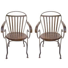 Great pair of antique iron arm chairs