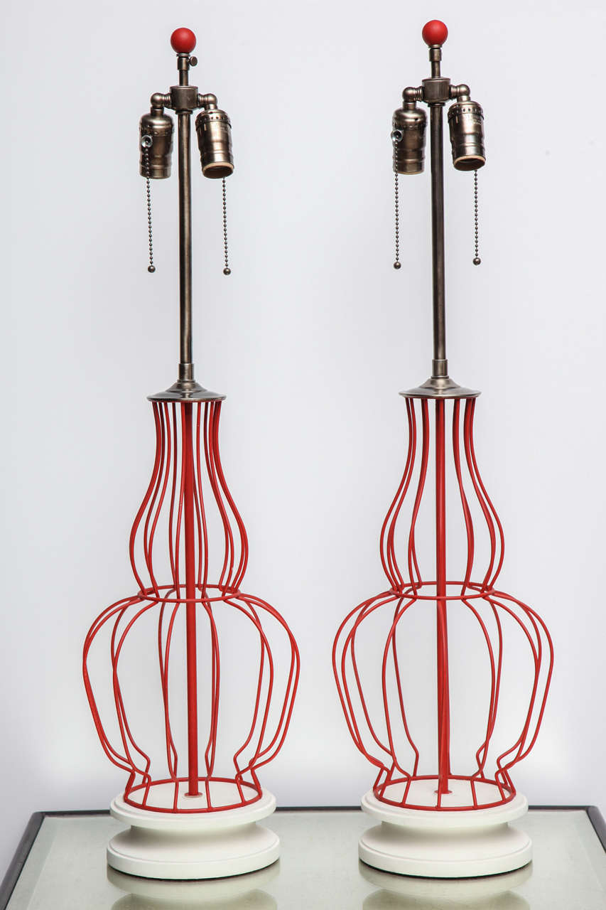 Pair of wire urn table lamps in the style of Tony Paul circa 1950 painted deep rose with Timidity painted bases and fit with antique nickel hardware