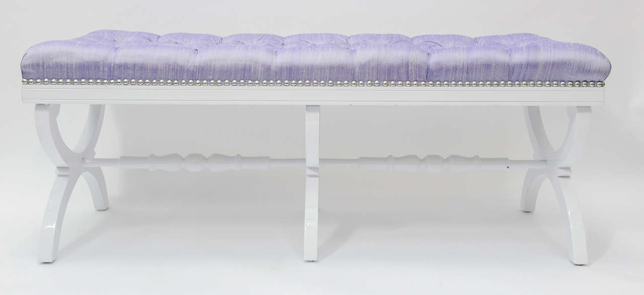 Very elegant glamorous tufted Hollywood Regency bench cover in lavender raw silk, finished with glossy nail heads.  The wood legs and supports have been carefully refinished in white. This bench will add instant chic to your room.