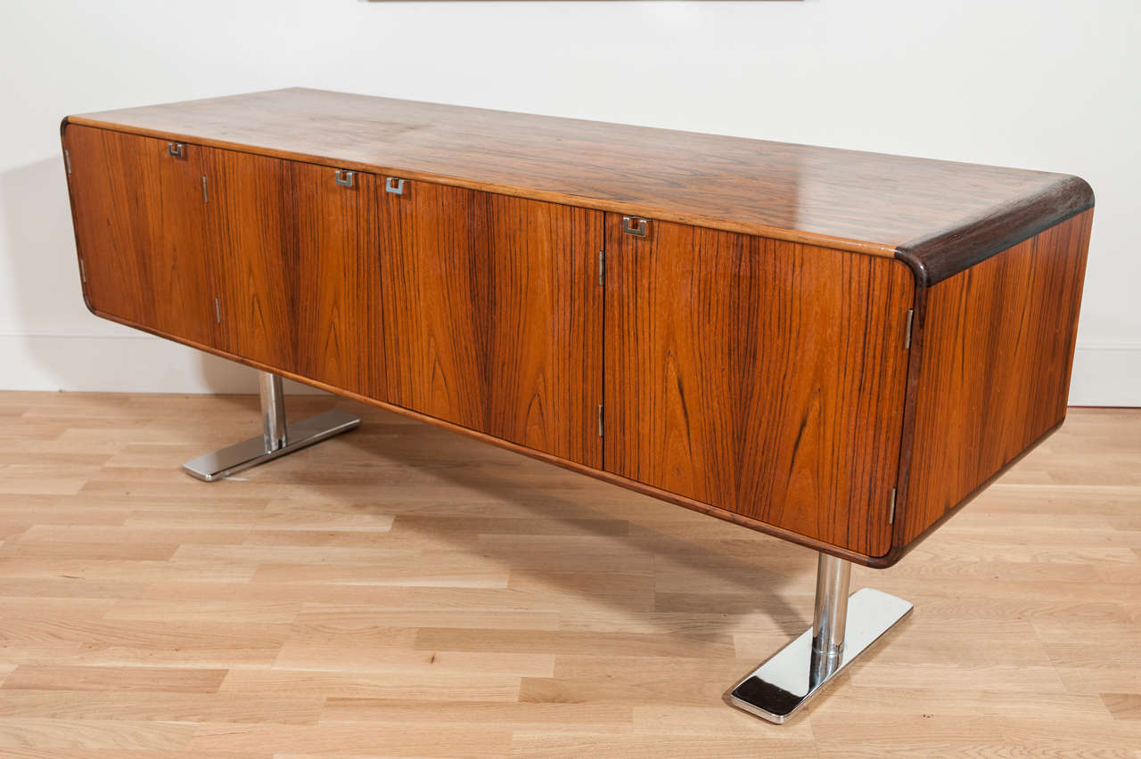 A bench made rosewood credenza with
stainless steel base. This classic Leif
Jacobsen 
