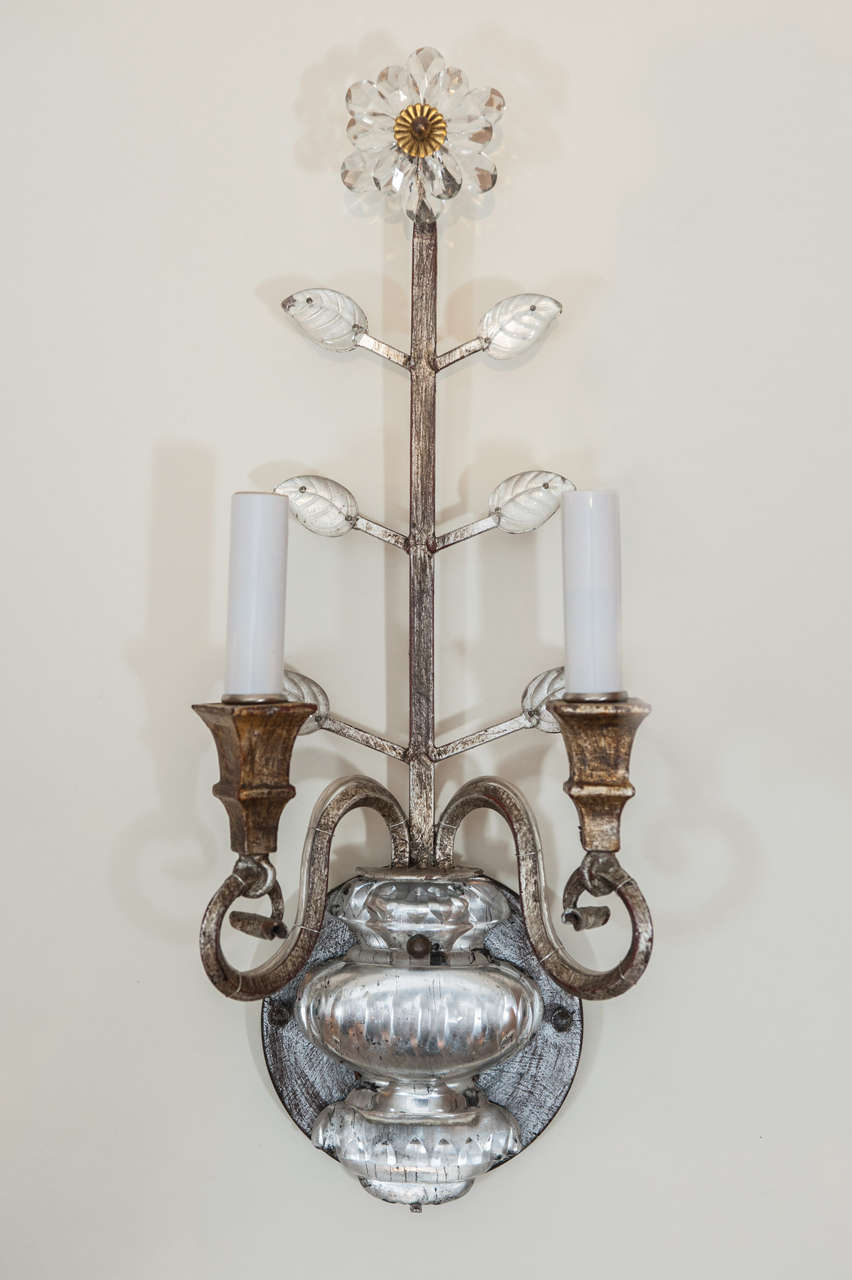 A decadent pair of Italian made two light sconces with crystal foliage and urn shaped base.
Rewired with matching backplate to accommodate North American standards.