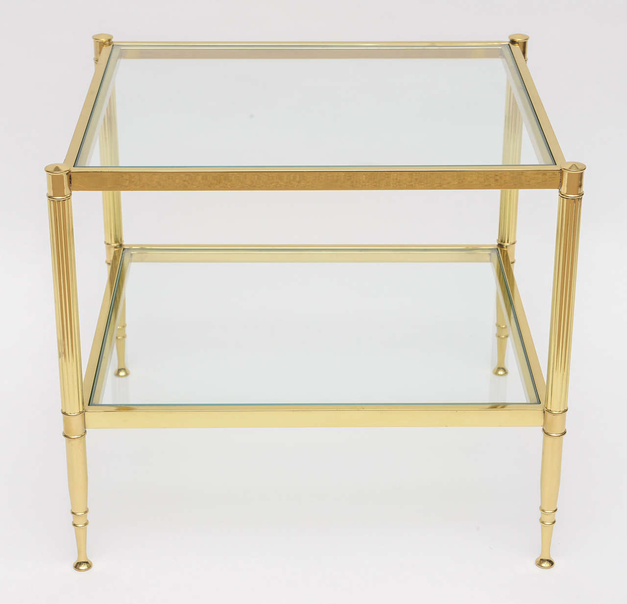 Mid-Century Modern 2 tier Side table in the style of Maison Jansen in brass with glass.
In good vintage condition with some light wear to the brass.
