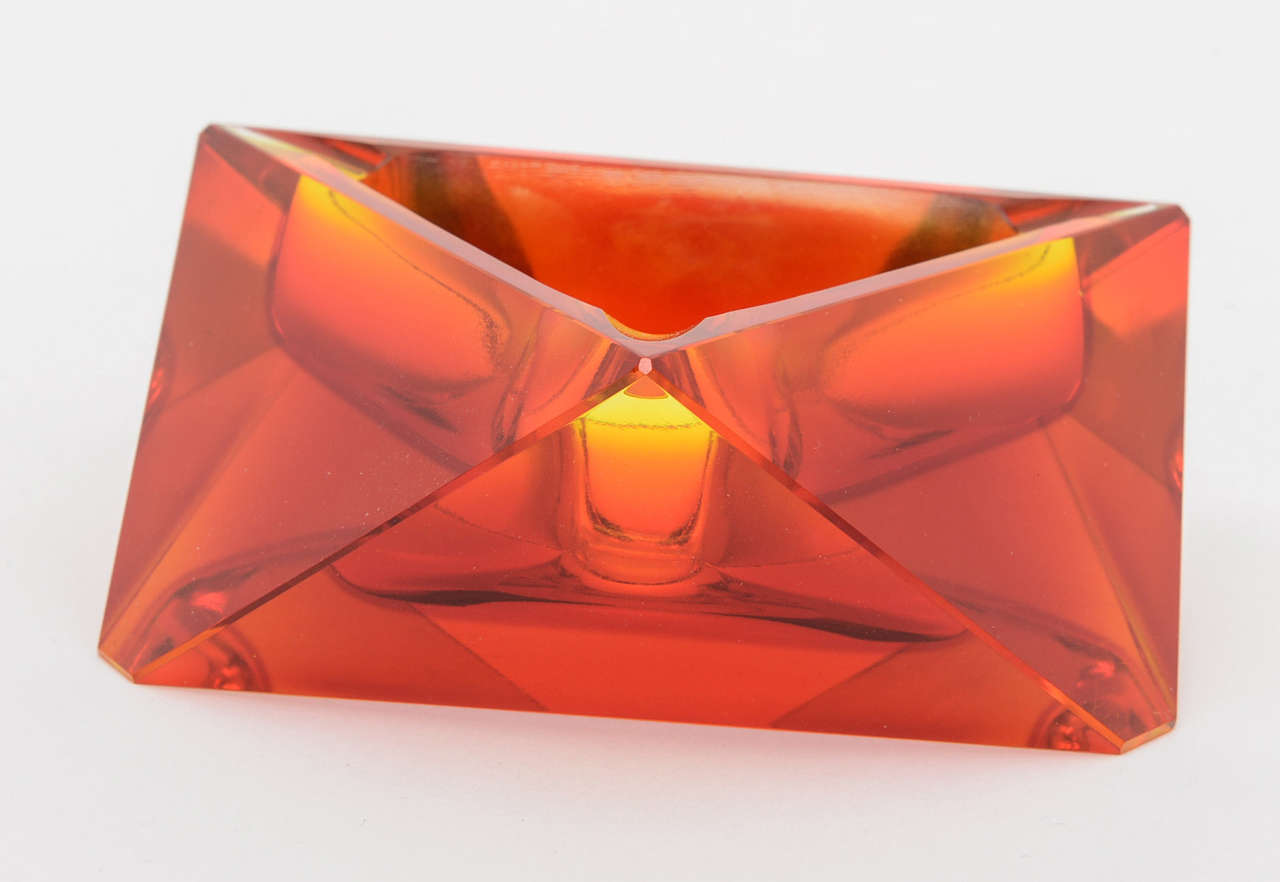 Multi faceted Murano ashtray in a deep inviting red hue.