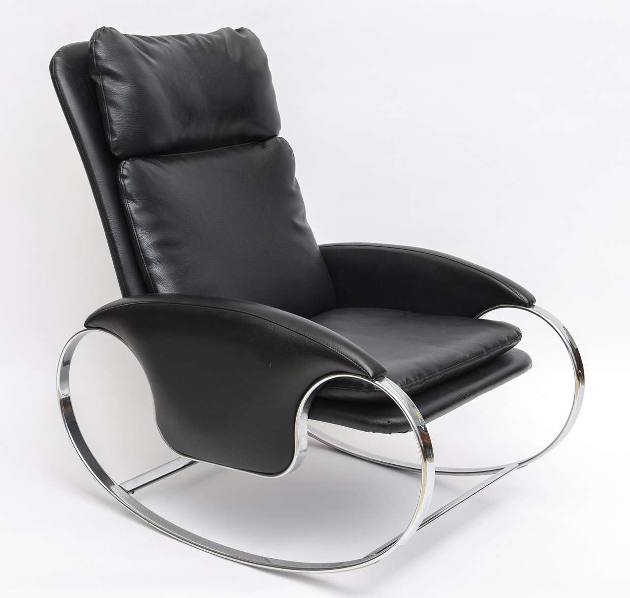 The high back upholstered seat above a chromed steel frame for Mariani/ Pace Collection. One is black and one in white

