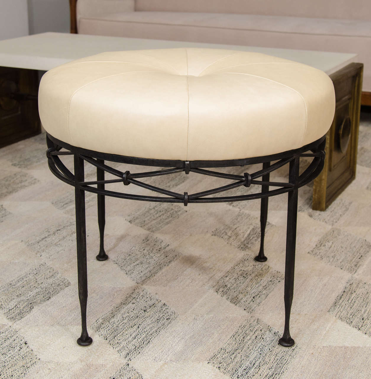 Beautifully crafted wrought iron base with newly upholstered leather seat.