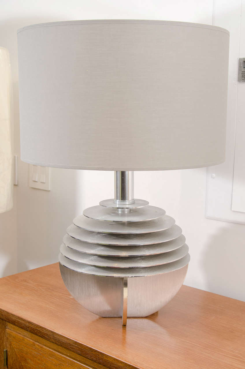 Aluminum discs assembled to create this light fixture. It captures the modernist ideals of 20th century design.