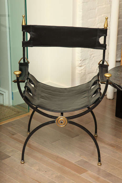 Roman inspired Savonarola chair of iron and leather with brass ornamentation