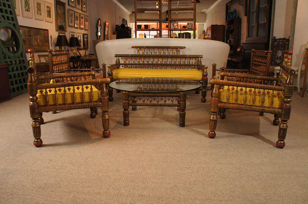 Here is a beautiful set of lacquered teak wood furniture from Sankeda in a  colorful patterned design. 
The set includes four arm chairs, a loveseat, and a coffee table.