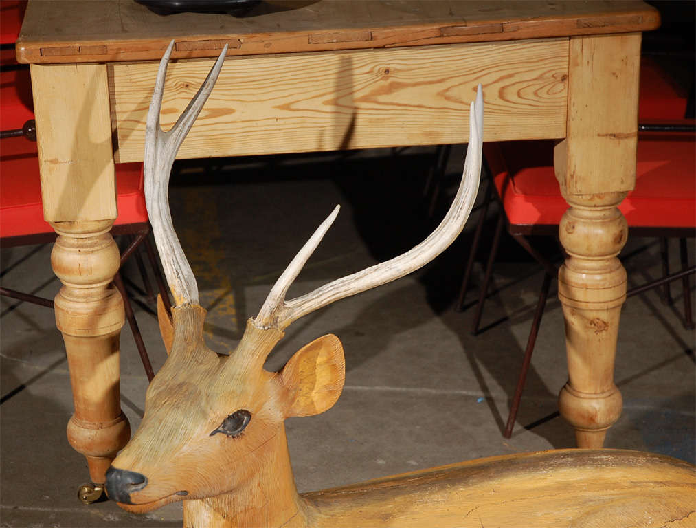 Reclining Carved and Painted Wood and Deer with antlers attached and hair eyelashes