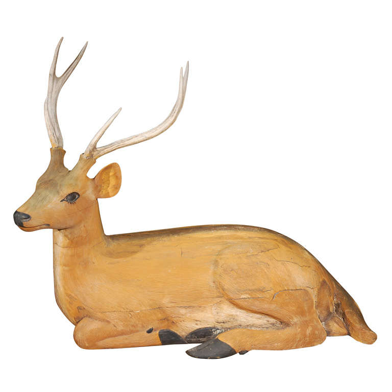 Reclining Carved and Painted Wood and Deer