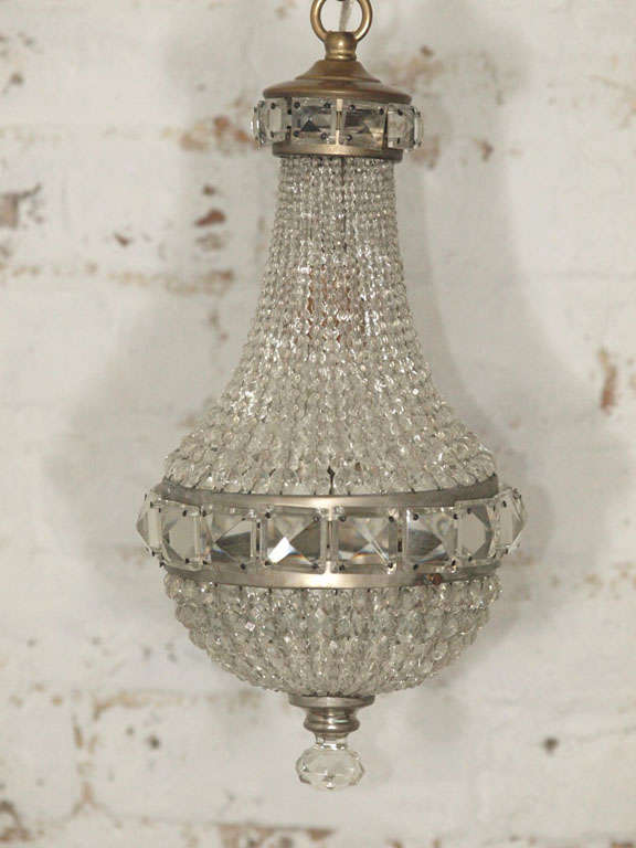 Petite Italian crystal chandelier in the empire style with original crystals and fittings.  Perfect for that powder room or above a baby's crib.  Newly wired for U.S. standards.
