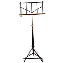 A 19th century English Black Lacquer and Brass Music Stand