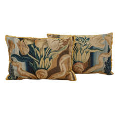 A pair of 18th century floral verdure tapestry pillows