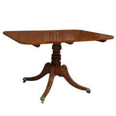 A Regency Mahogany Breakfast Table with Rosewood Banding