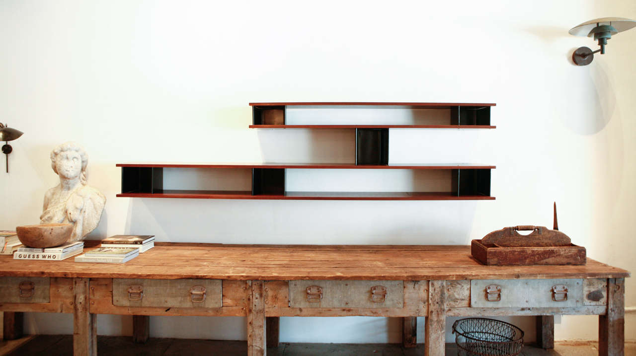 the nuage bibliothèque designed by charlotte perriand . produced in 1956 for ateliers jean prouve.

