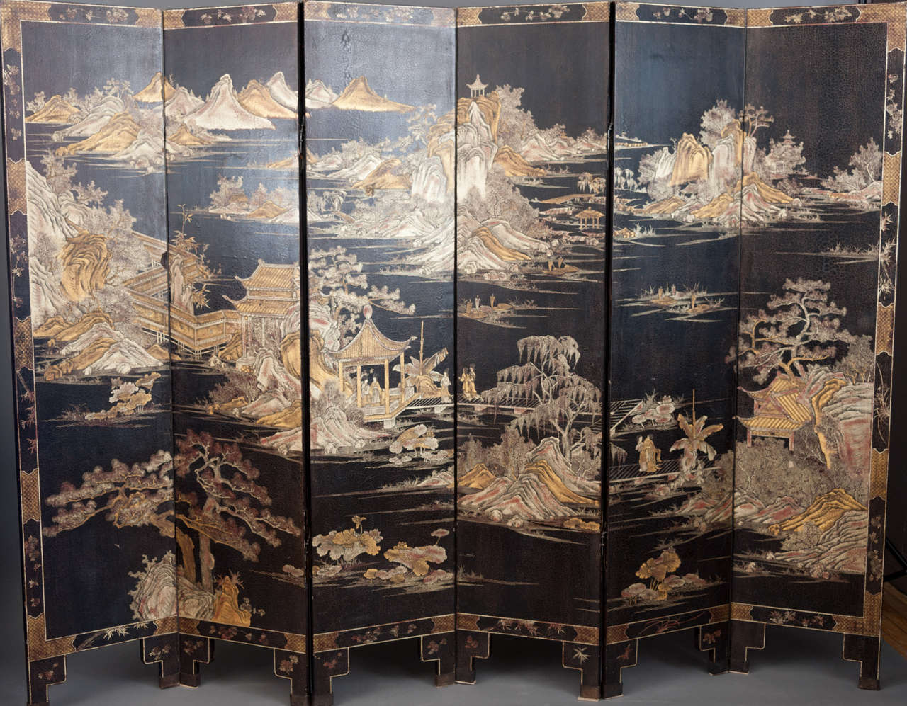 
A wonderful 19th century Chinese lacquer 
six fold screen depicting landscapes, figures and buildings.

Each panel measuring 16”, 40.5cm wide and 
72”, 184cm high. The whole 98.5” wide.