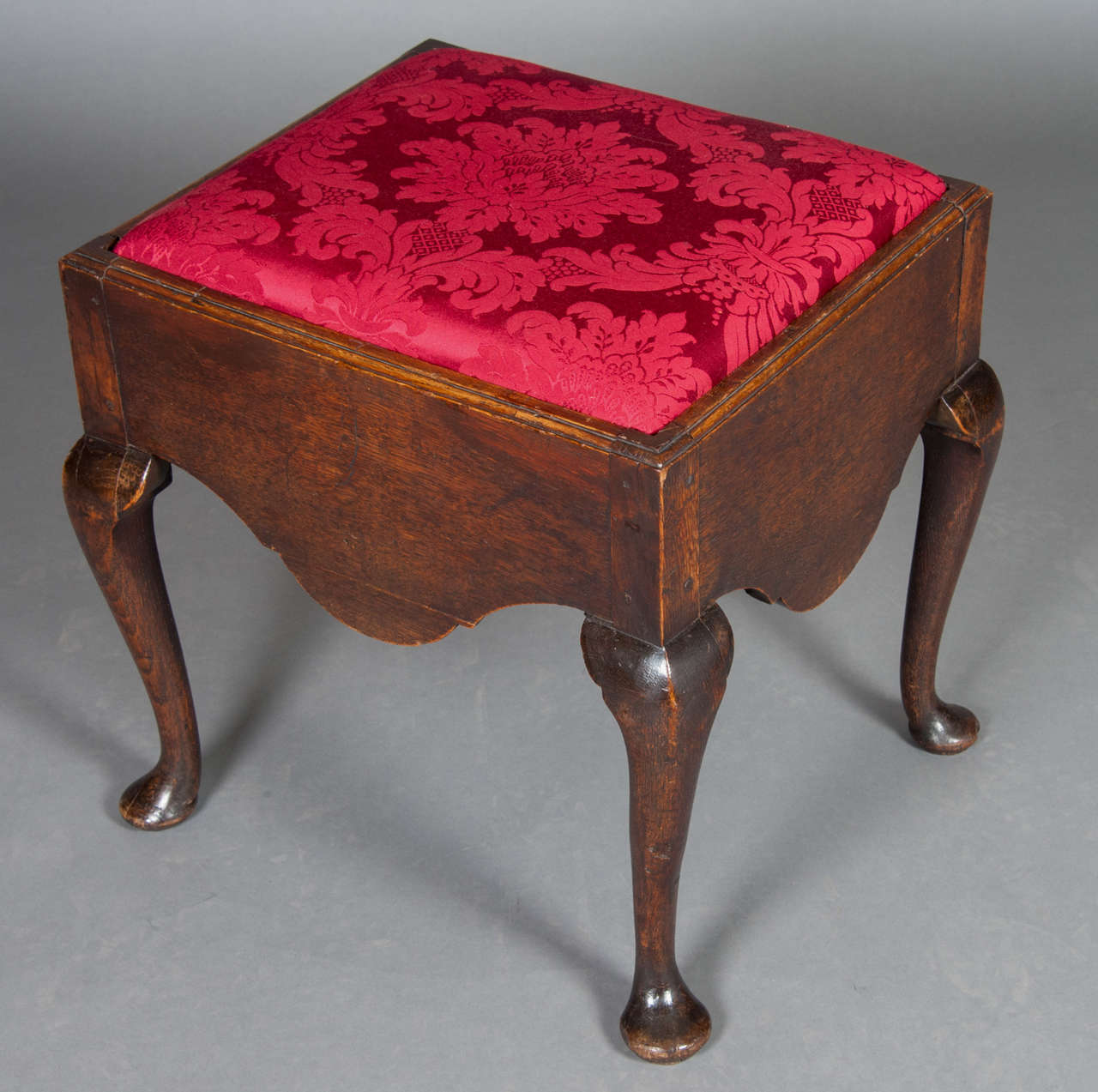 A fine mid-18th century oak dressing stool on cabriole legs and pad feet.
