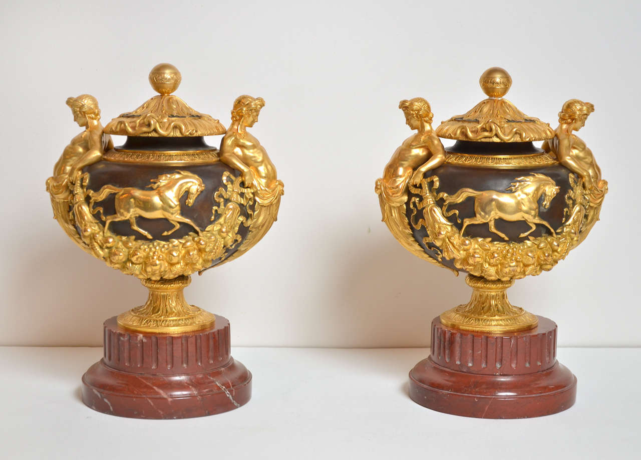 Rare pair of vases with top, in gilded and double patina bronze, on a removable griotte marble base.( hight of the base 3 