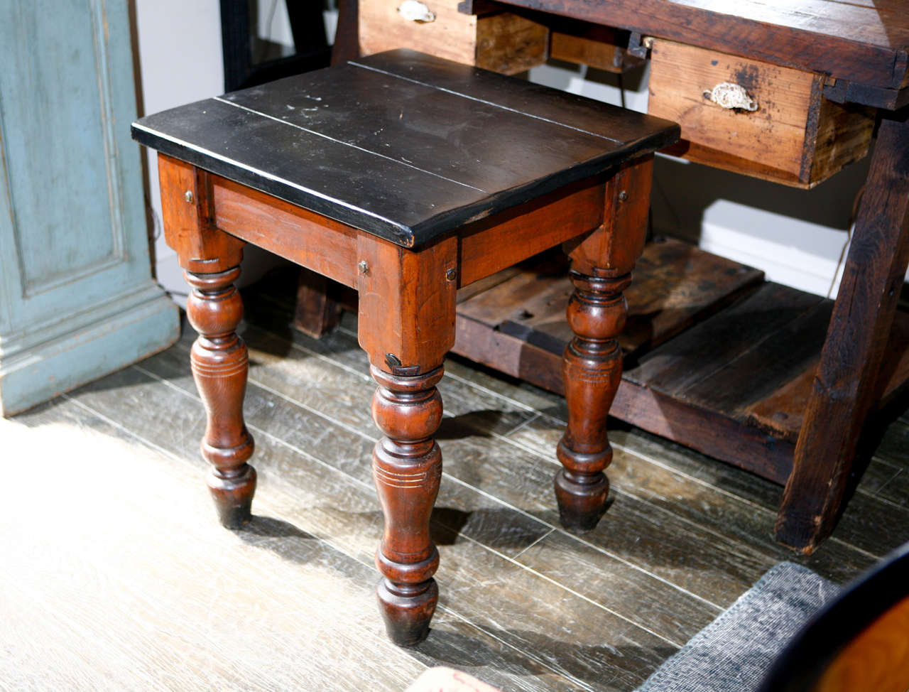 A square table on ring-turned legs with a black painted top. This table can be paired with a matching table with a slightly bigger top (3 inches more width on top) 