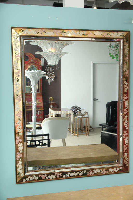 Églomisé 1960s style flowers on a gold background framed mirror.