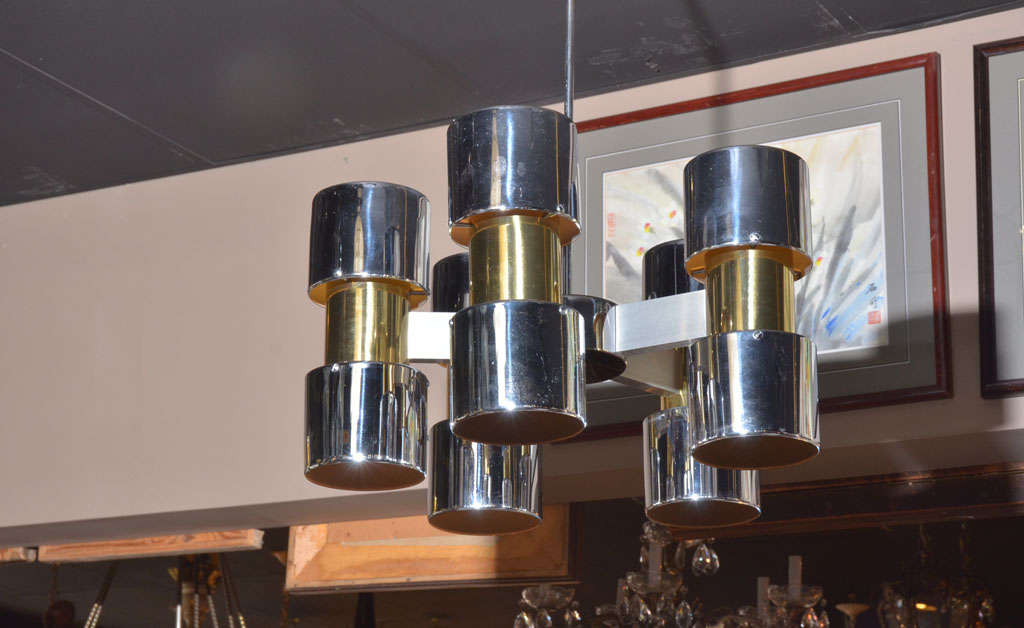 Chrome with brass accent Mid Century Chandelier. Five arm, with 10 up and down lights.Measures 36