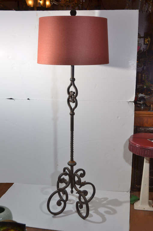 Hand wrought iron floor lamp, with two light pull chain light unit.  They can be off/on or three way pull chains.  Lamp is wired on the outside but undetectable from one side.  The lamp is priced without shade.  Lamp shade is 22
