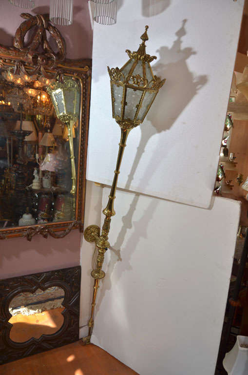 Pair Incredible Hollywood Regency Style, Cast Brass Torch Wall Sconce with Lantern type top.  Originally out of Faculty Club at University of Texas in 1960's.  The Sconce extends from the wall at the top 20