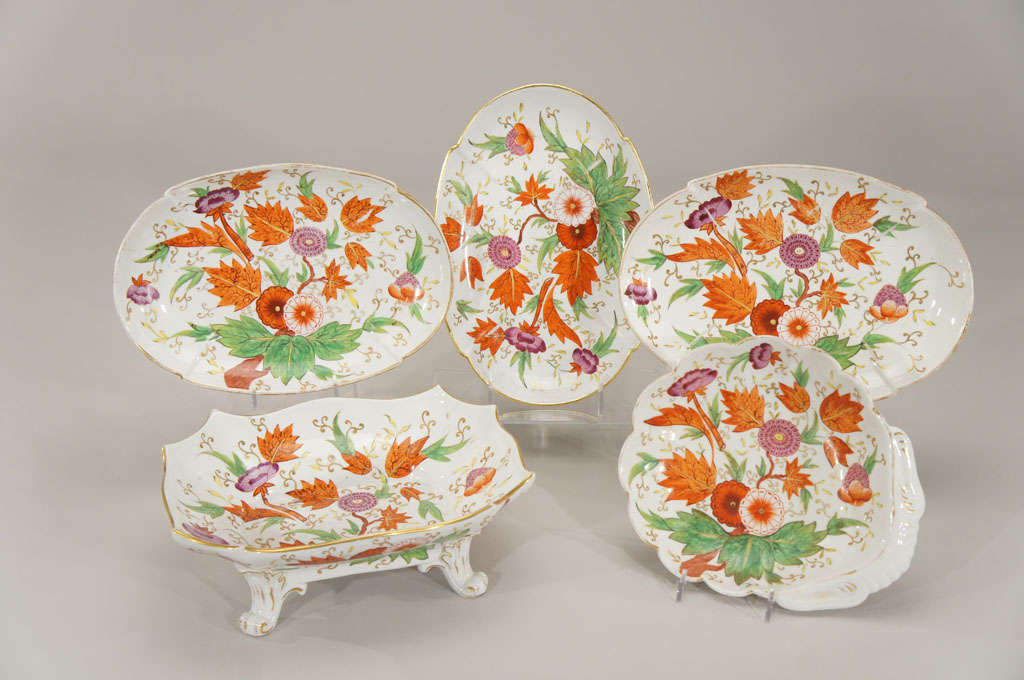 These five pieces of early 19th c. porcelain create a beautiful grouping of decorative and functional pieces. There are 3 oval bowls, one footed centerpiece and a shell-shaped bowl all hand painted in a fabulous combination of greens, orange and