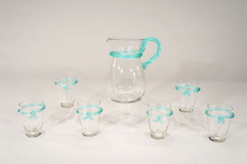 This charming set for 6 includes a pitcher and 6 matching goblets each with an elaborately applied turquoise 