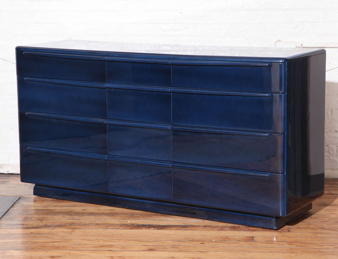 A sideboard/dresser/chest of drawers. Lacquered midnight blue. By Heywood Wakefield