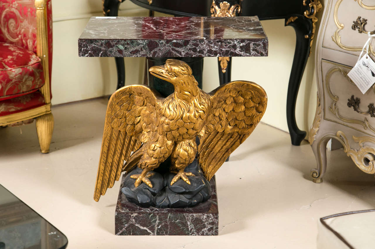 Federal style giltwood carved eagle pedestal table. Fabulous detail in this piece down to the Eagle's claws sitting on the rocks. A marble base matching the marble-top adds to this exquisite piece.