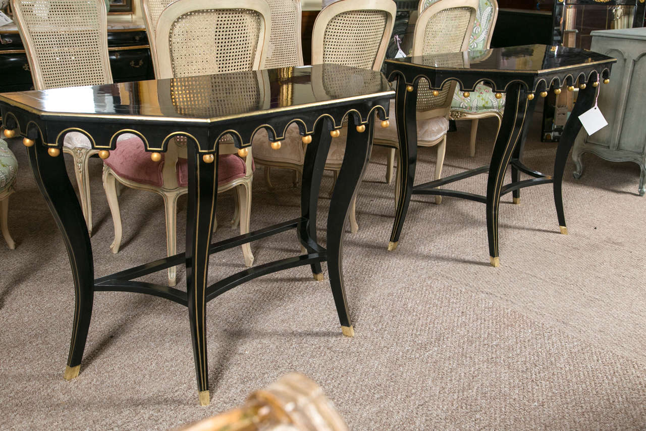 Hollywood Regency Pair of Ebonized and Gilt Decorated Console Tables By Maison Jansen