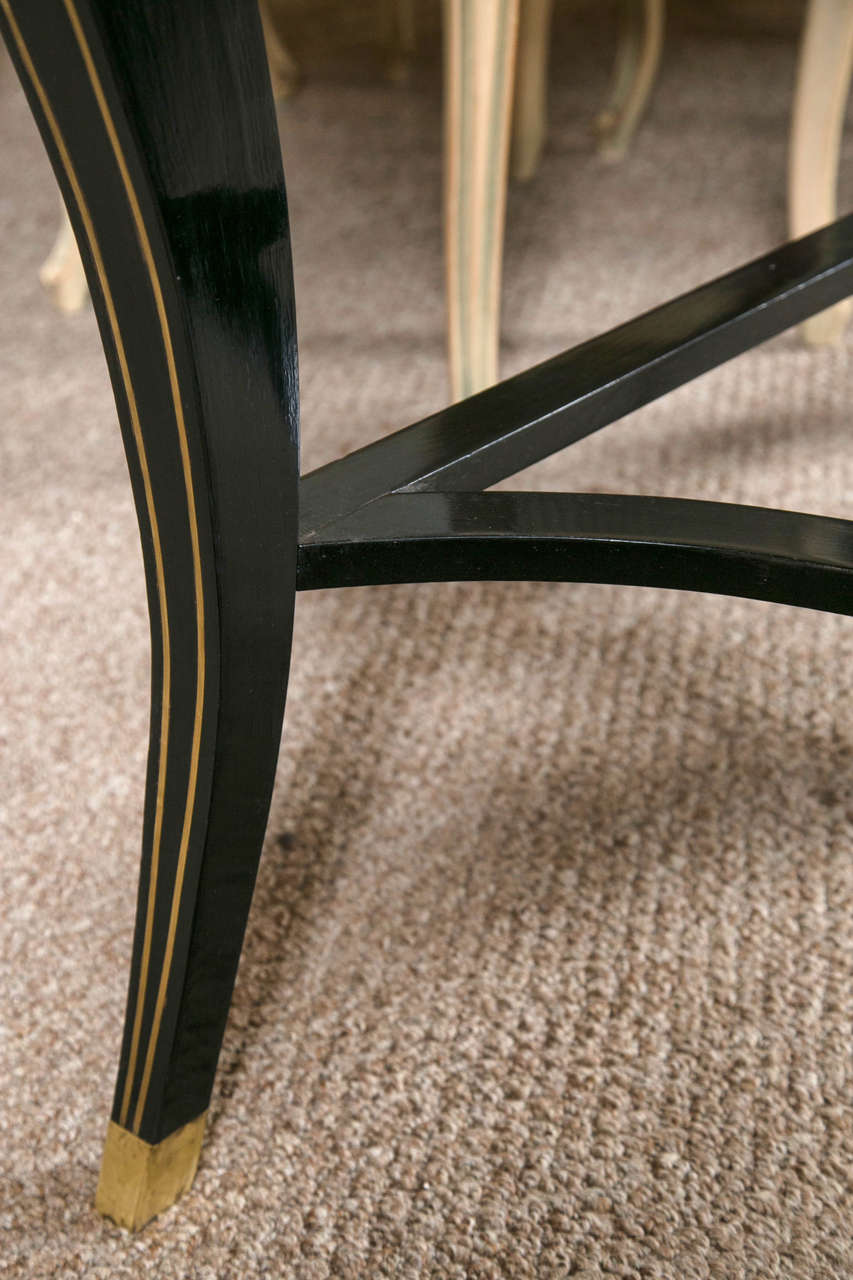 Mid-20th Century Pair of Ebonized and Gilt Decorated Console Tables By Maison Jansen
