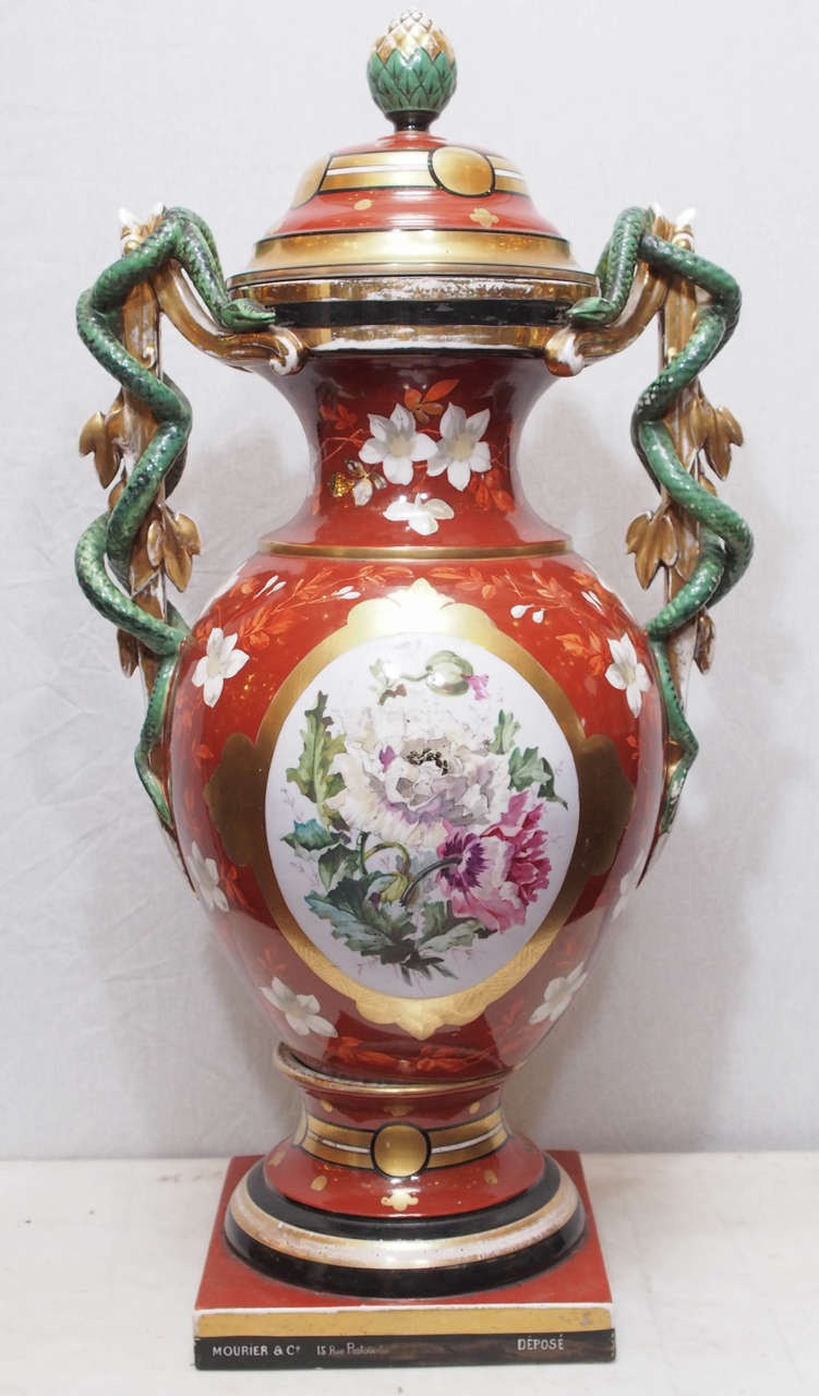 French Vieux Paris (Old Paris) lidded apothecary jar with snake adorned handles and a floral medallion front. Made by Mourier and Co. 15 Rue Pastourelle, 19th century.