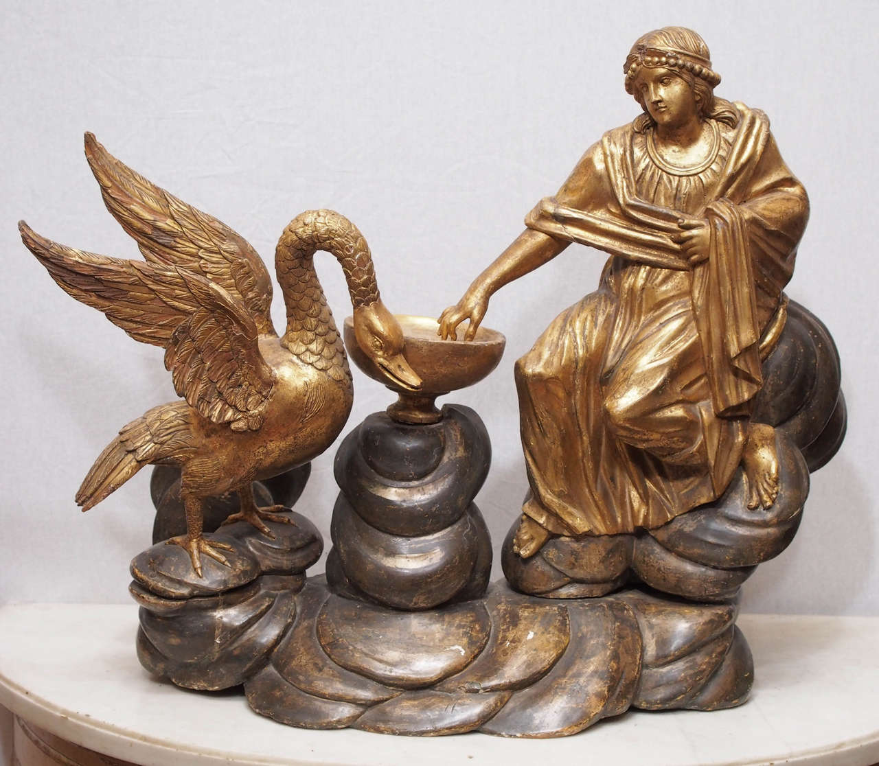 Exceptional carved Gilt Wood Grouping of Led and The Swan with a water basin and a silver gilt Cloud Base.