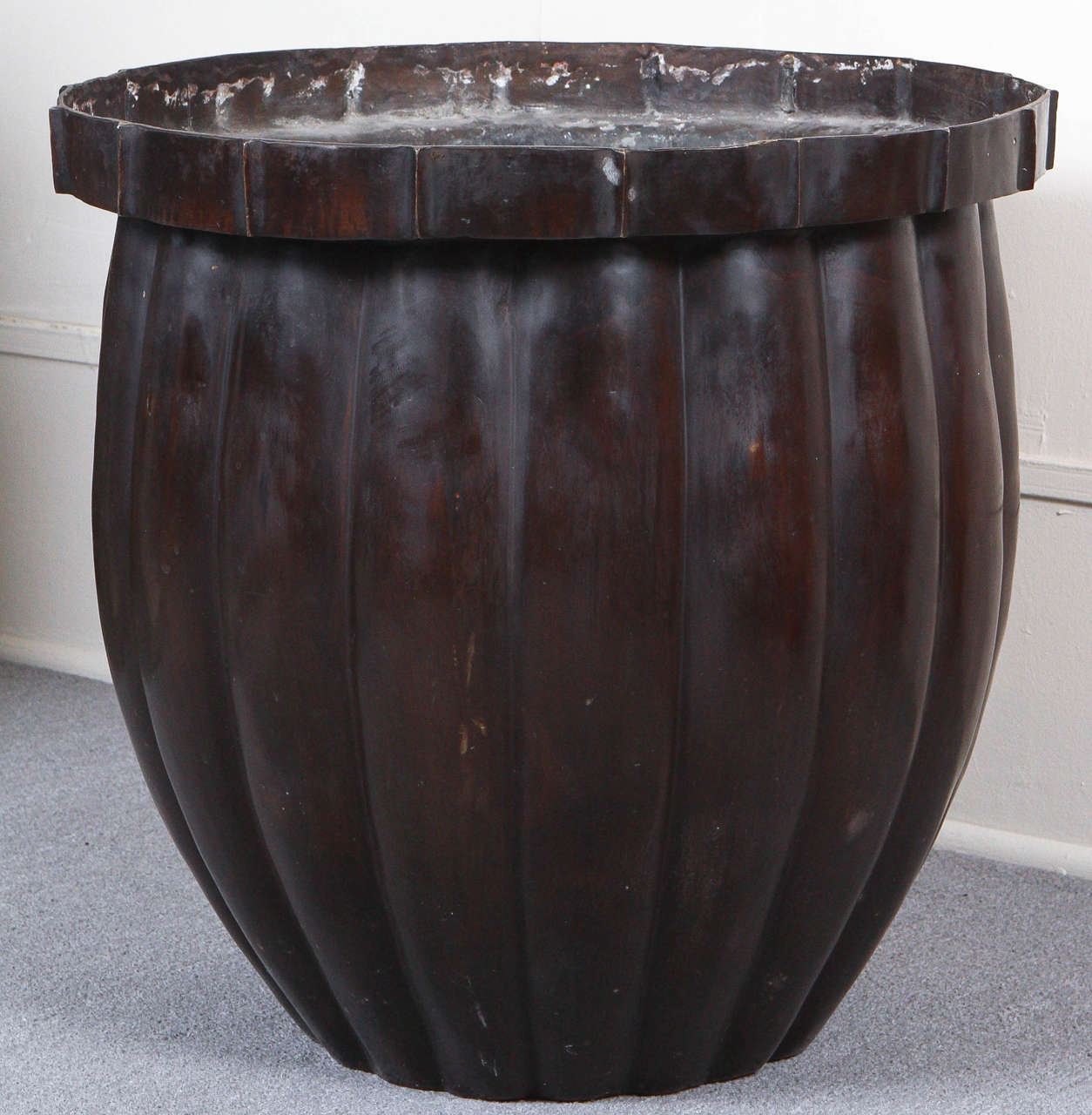Pair of very large cast bronze colored planters.
This pair of exceptional planters are a dark bronze color with very little weathering or patina and minimal scratches.
These are a modern version of an antique bronze Chinese design.