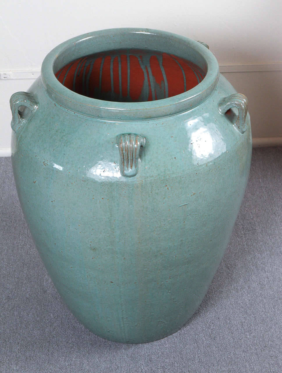 Monumental Amphora style vase with a stunning Jade green glaze finish.
The vase came from a prestigious Indian Wells estate with interior completely designed by Steve Chase.