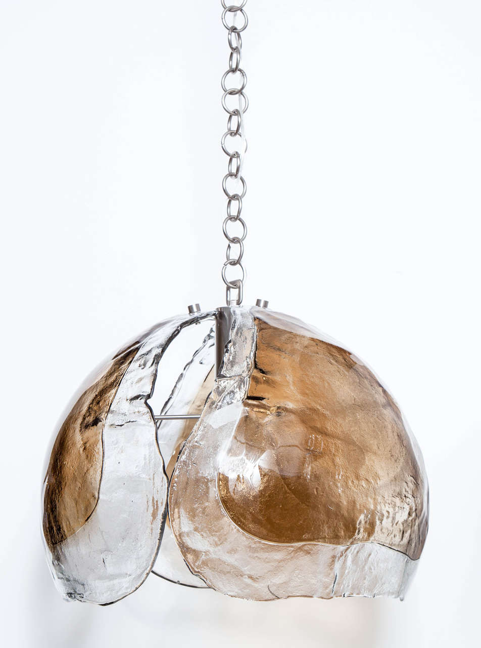 Mid-Century Classic Murano glass pendant composed of three panels in clear and smokey topaz glass suspended from a satin nickel chain. One central bulb, 100W max. Glass measures 15 inches tall.