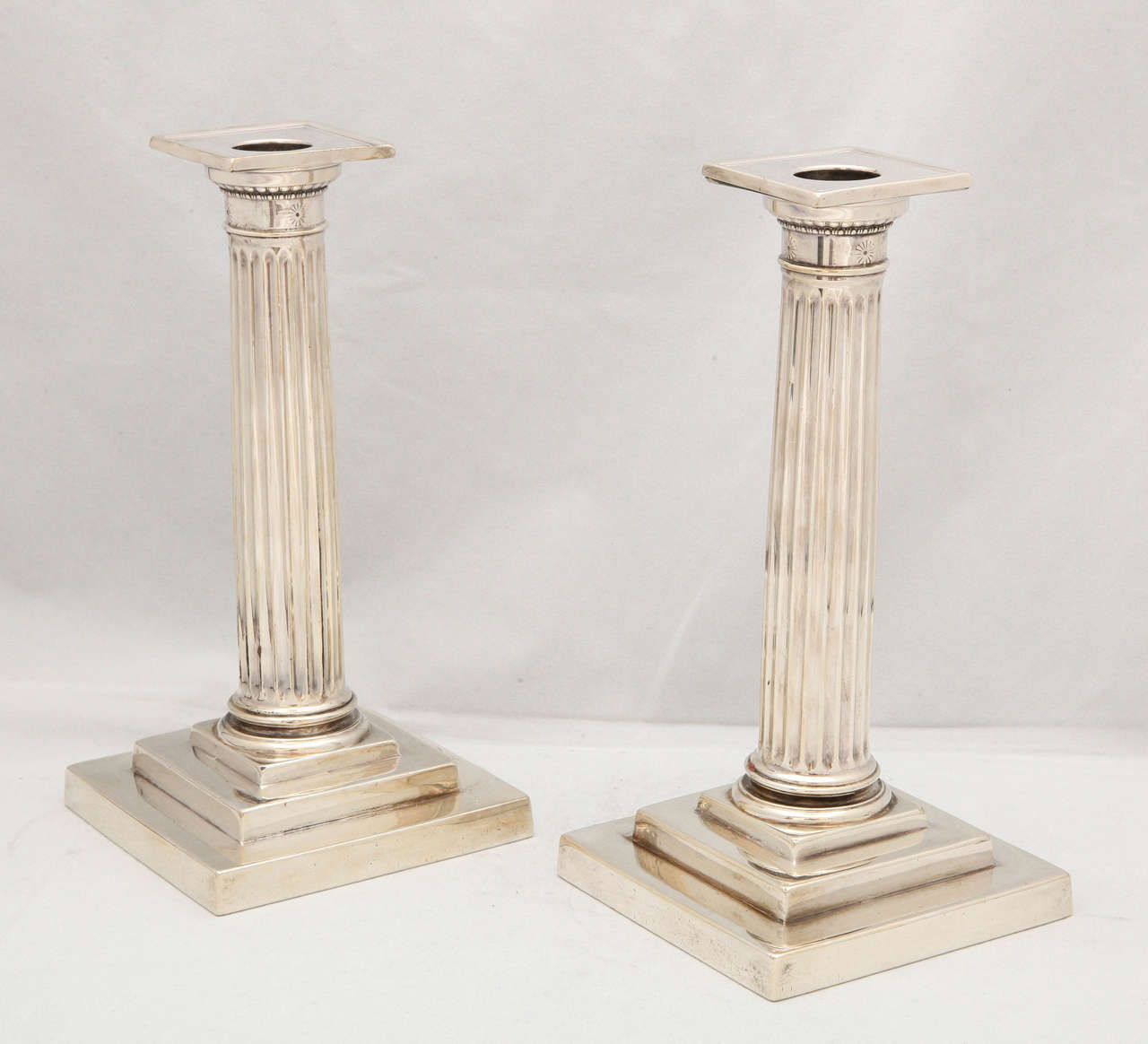 Edwardian pair of sterling silver, column-form candlesticks, The Gorham Corp., Providence, Rhode Island, year marked for 1908. Lovely etched rosettes around 