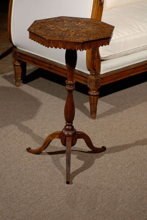 19th century carved walnut pedestal table from the black forest, circa 1860.
Beautifully carved overlapping leaves decorate the pedestal and apron while vines, acorns, and flowers appear on the top. There are two small drawers cleverly constructed