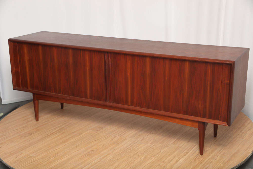 Beautiful, low-profile sideboard in walnut. The tambour doors are in great condition, materials and overall build quality are excellent.