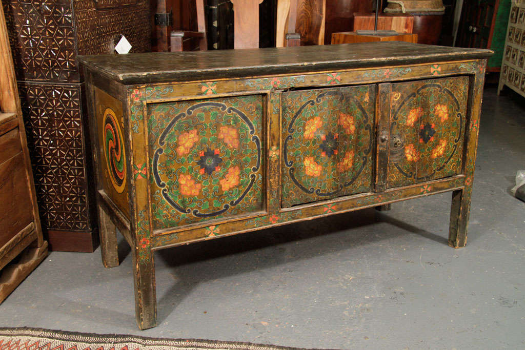 Painted Monastery low table from Tibet. Monks would sit down at this table for meals, writing and other tasks.