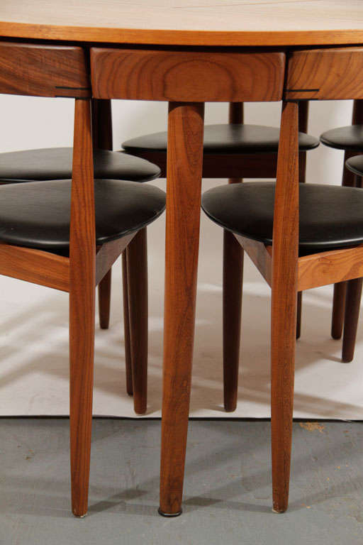 Iconic Hans Olsen Teak Dining Set. This is the version with the hidden butterfly leaf extension. Closed the set has a diameter of 42