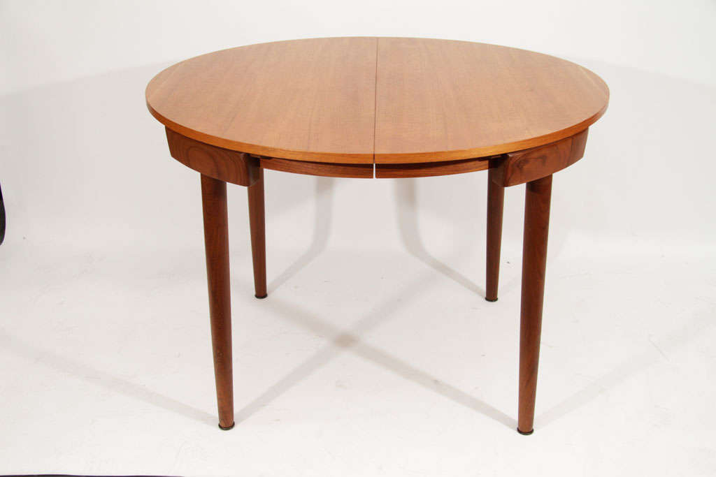 circular dining table with hidden chairs