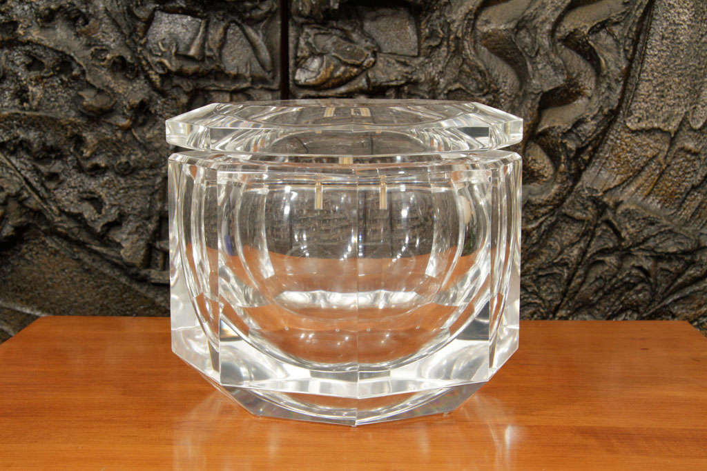 Gem like quality Lucite decorative box or ice bucket with pivoting top, in the manner of Alessandro Albrizzi. This design piece was presented by Carole Stupell in the US. Signed Kazan 1983. Please contact for location.