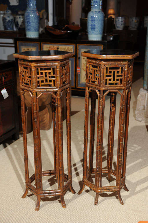 Chinese vintage lacquered bamboo plant stands with black wood top.  Priced and available individually at $995 each.  Sale $525 each.