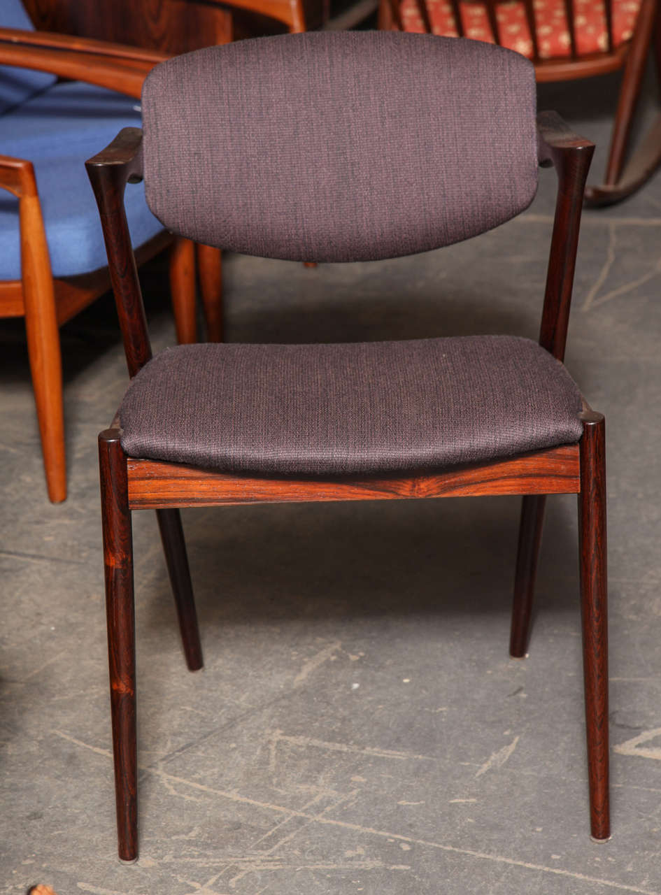 Vintage 1960s Rosewood no. 42 Chairs by Kai Kristiansen.

This set of Vintage Side Chairs are in like-new condition. The back swivels up and down and adjust to support your back any way you are sitting; like a little lounge chair at the dining