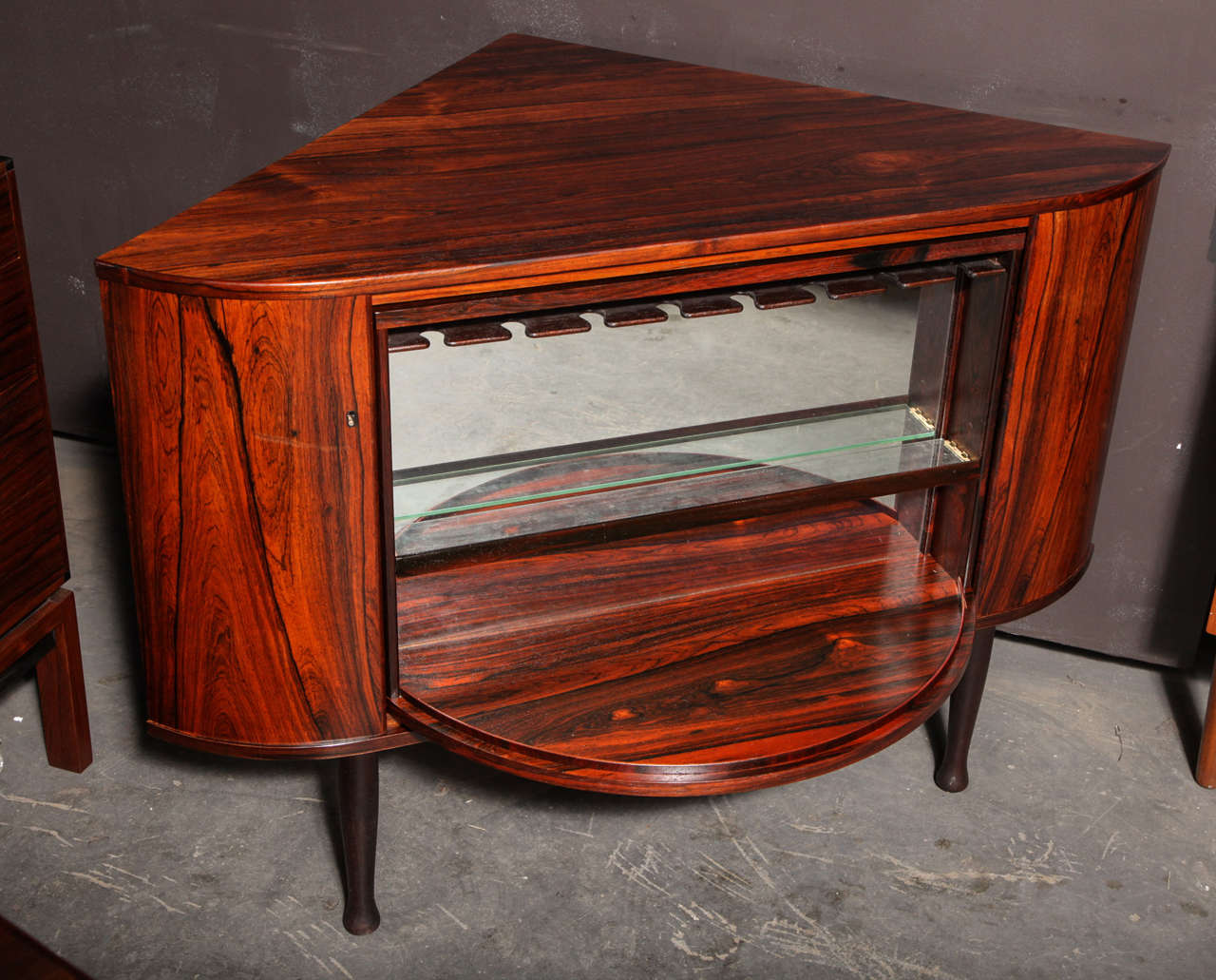 Vintage Norwegian Lazy Susan Bar Cabinet by Torbjorn Afdal.

This Retro Liquor Cabinet is the coolest one you will ever see. The liquor hides if you spin it around to the bookshelf. Look at the pictures. The bar is in like-new condition, and fits